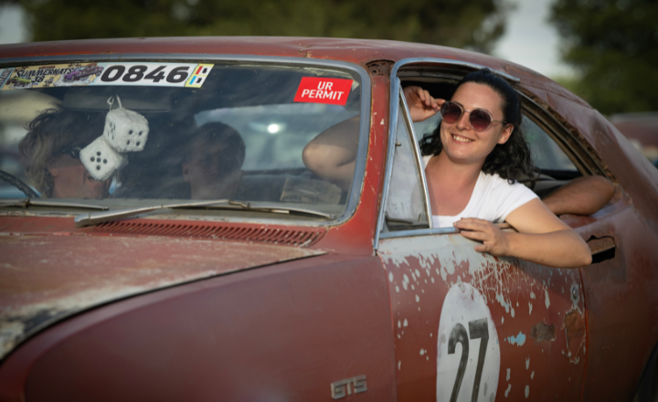 Summernats entrant passenger leaning out of car window 720x440 Summernats entrant passenger leaning out of car window