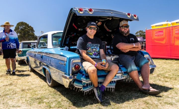 Two Summernats entrants sitting in the boot of a car - 720x440 Two Summernats entrants sitting in the boot of a car
